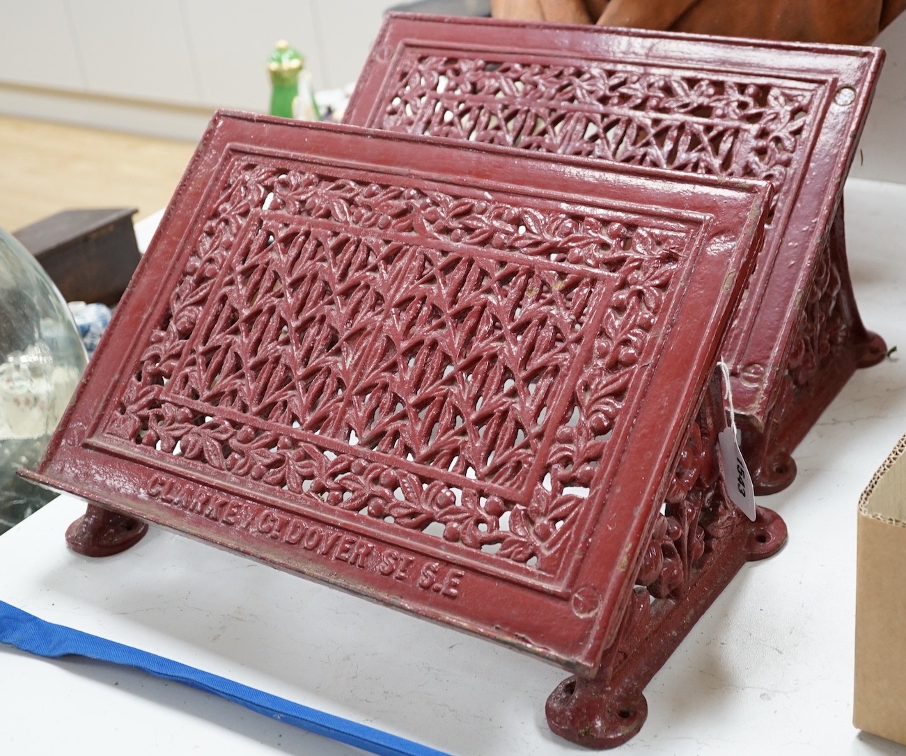 A pair of painted cast iron lecterns marked ‘CLARKE CT DOVER ST S.E’ 42cm wide